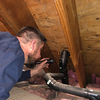 CTR Home Inspector Inspecting an Attic